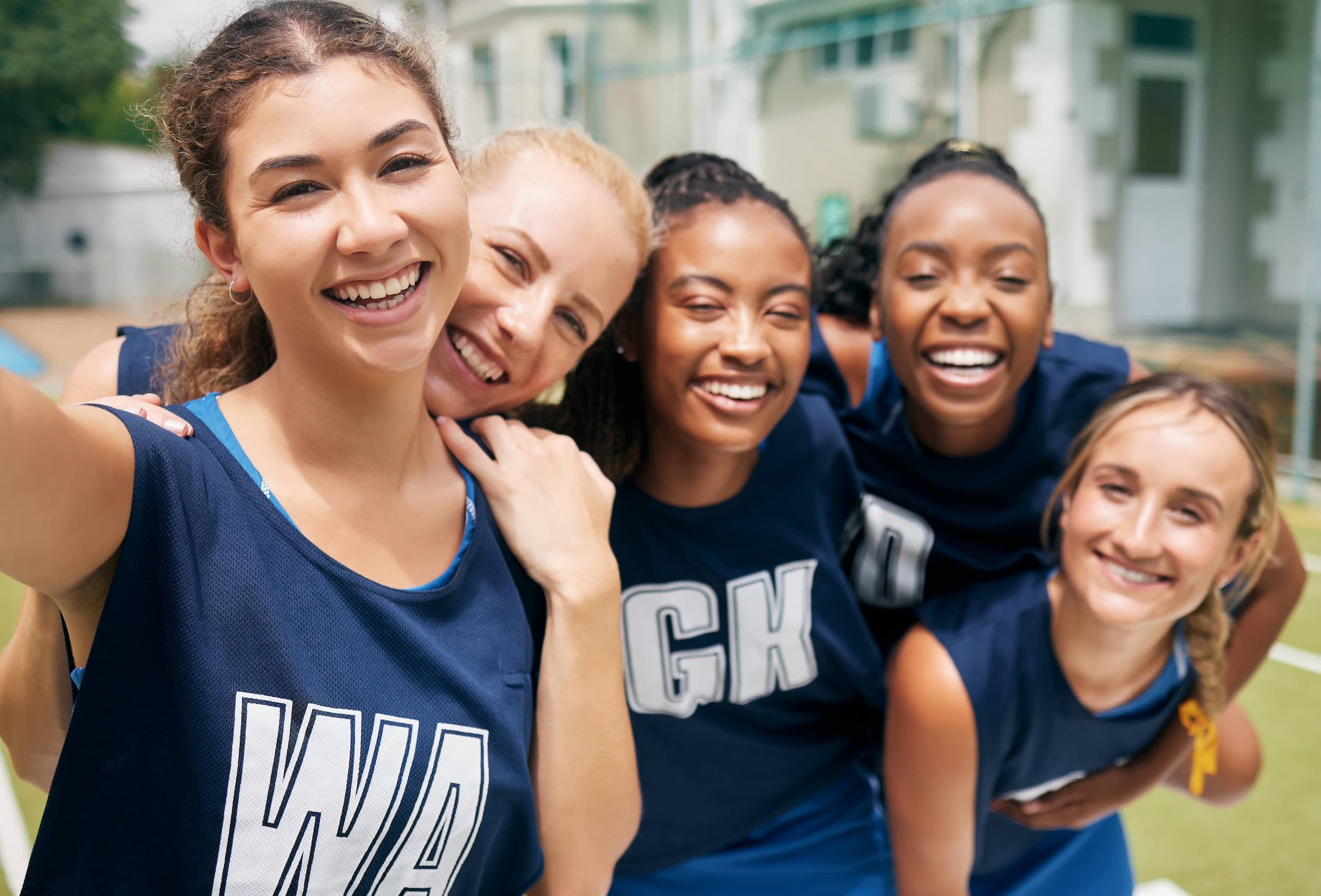 Sports netball team and selfie of women